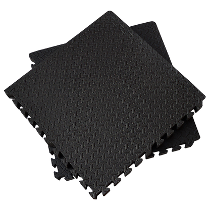 Black foam puzzle mats on a white background