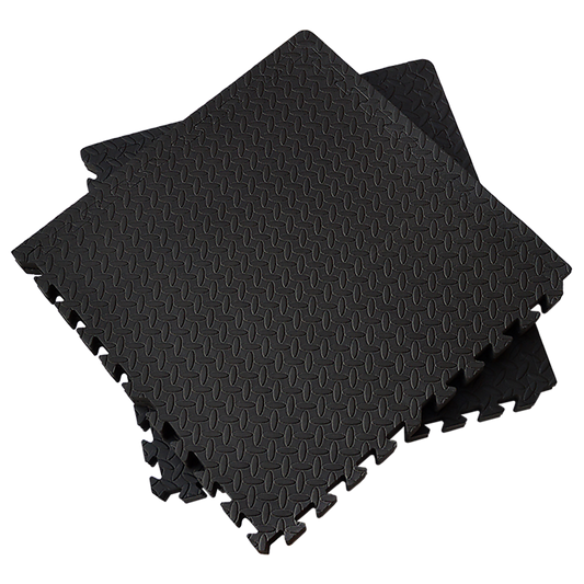 Black foam puzzle mats on a white background