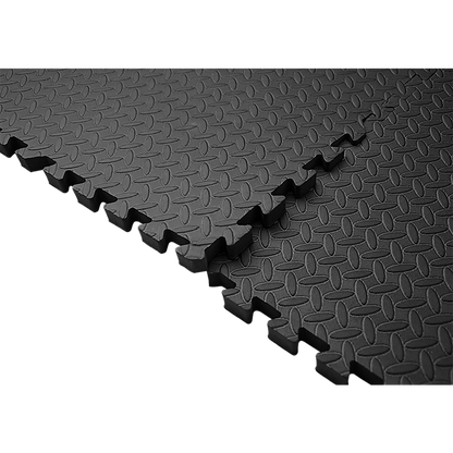 Black interlocking foam mats on a white background