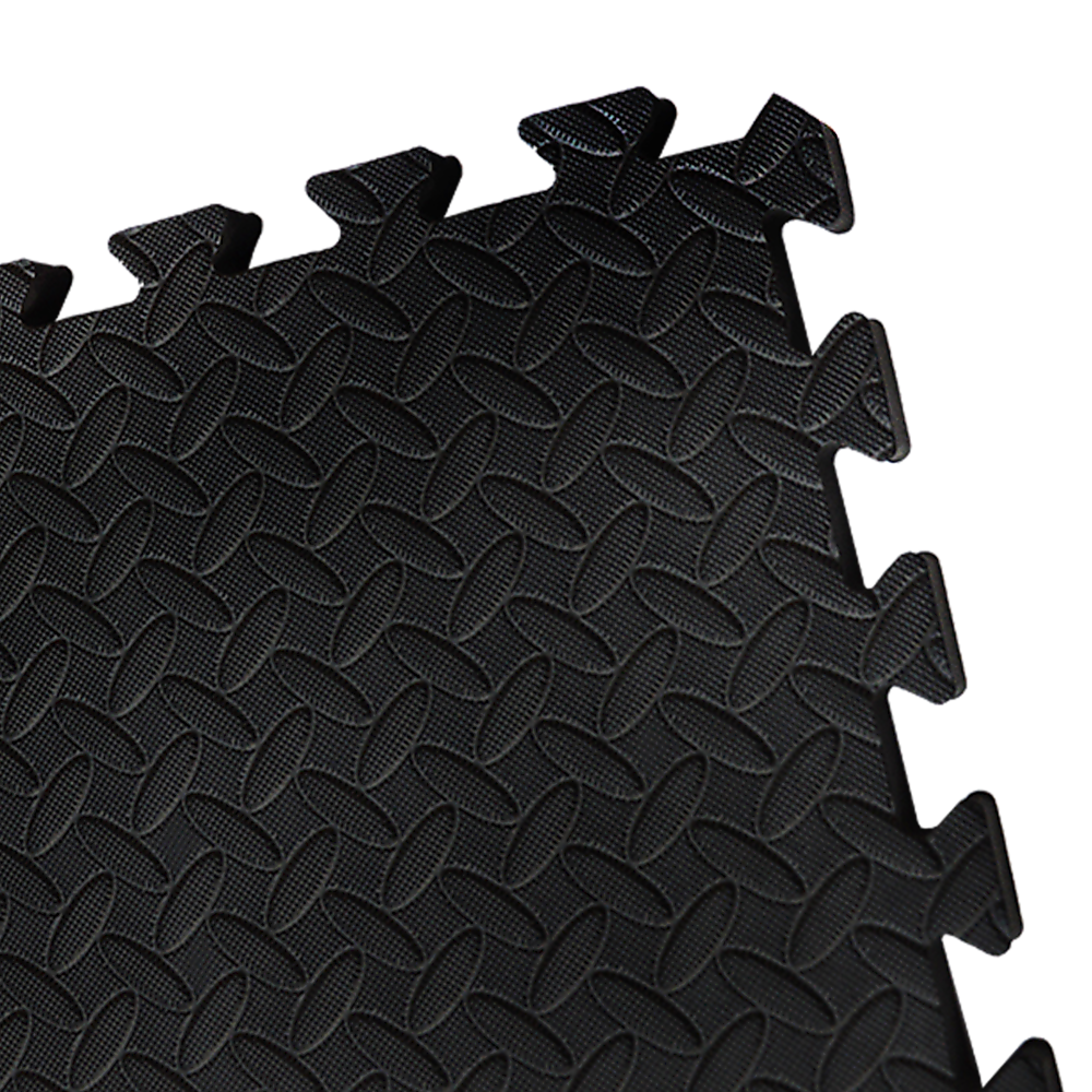 Black interlocking foam mats on a white background