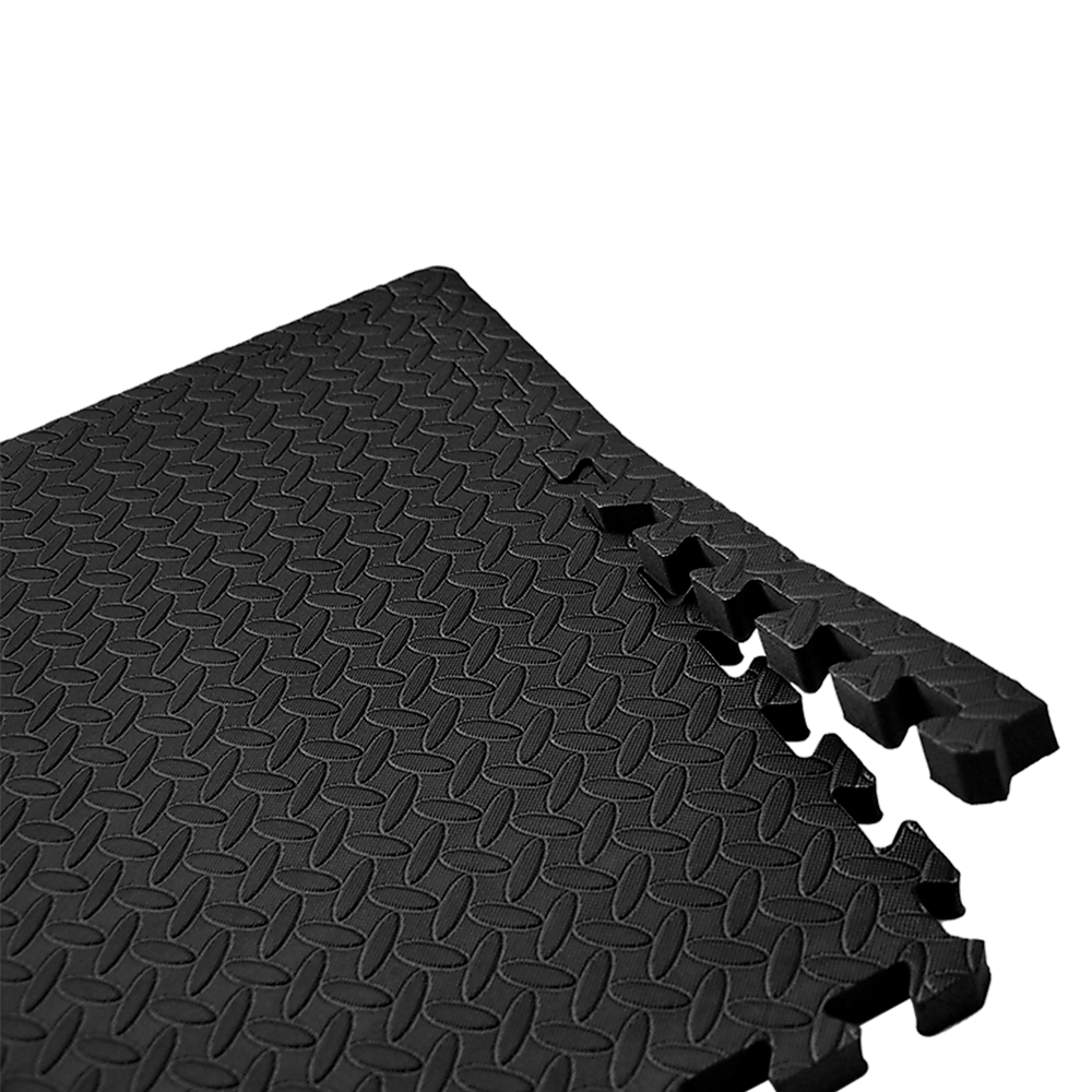 Black interlocking foam mat on a white background