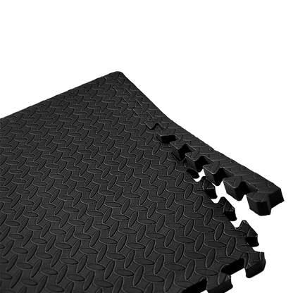Black interlocking foam mat on a white background