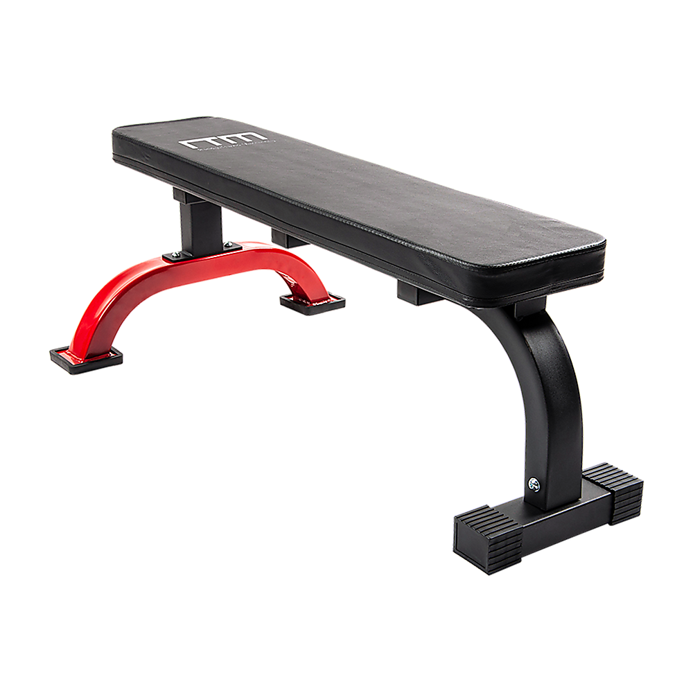 Black weight bench with red leg extensions on a white background