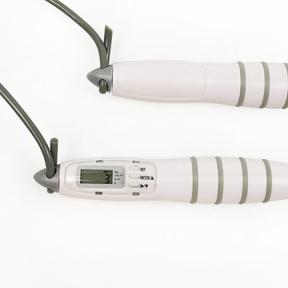 White digital jump rope with green accents on a white background