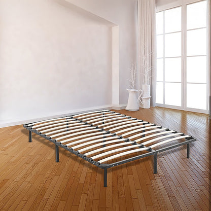 Bed frame on a wooden floor with large windows in the background