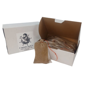 Open box containing a Captain Jack's product with a brown drawstring bag and packaging on a white background.