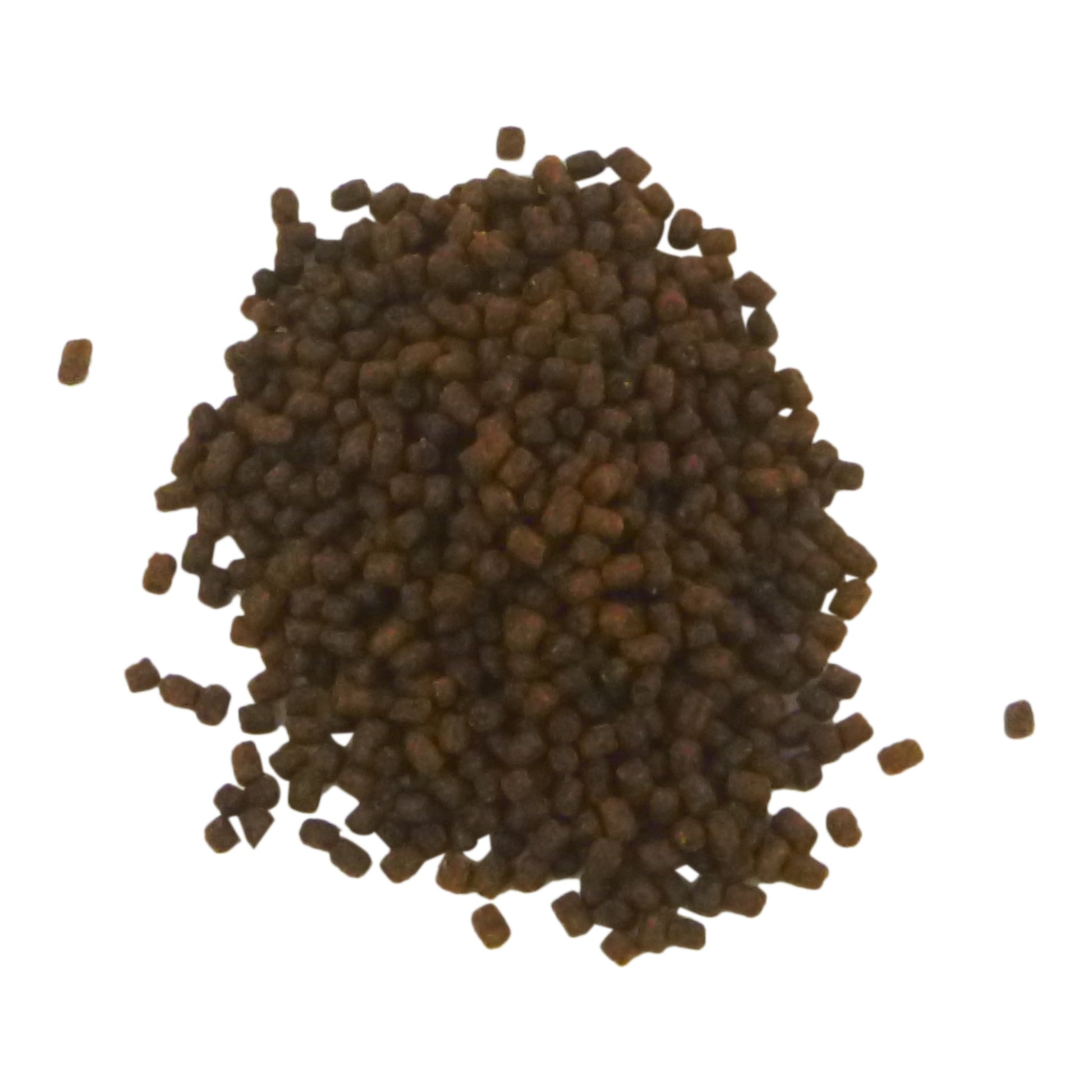 Brown pellets on a white background