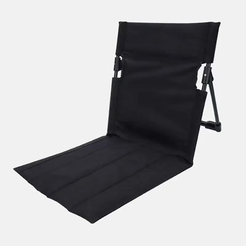Black folding chair on a white background