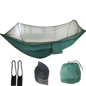 Automatic pop-up Camping Hammock with mosquito net  in green with included straps and carabiners, displayed alongside its compact folded form.