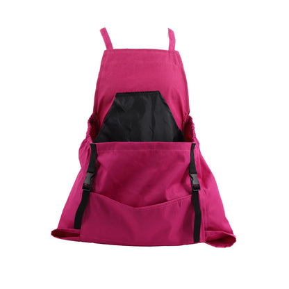Pink pet carrier with black interior on a white background