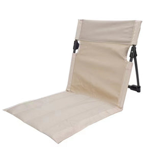 Beige folding beach chair on a white background