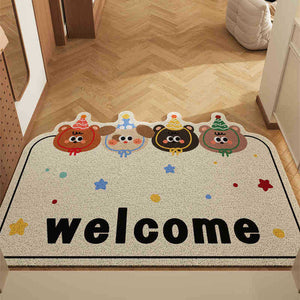 Decorative doormat with cartoon characters and the word 'welcome' on a wooden floor.
