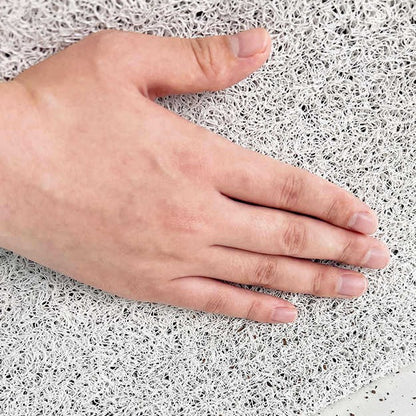 Hand resting on a textured white surface