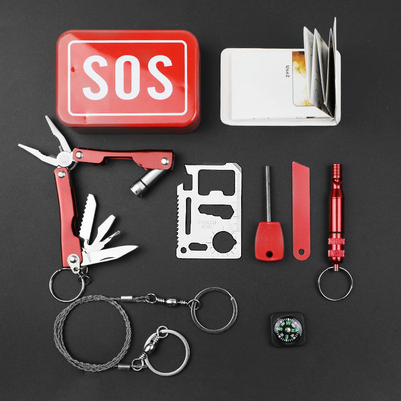Collection of survival tools including a multi-tool, knife, and compass on a black background.