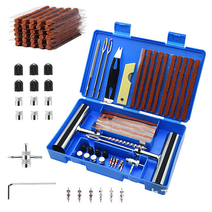 Tire repair kit with various tools and components in a blue case on a white background.