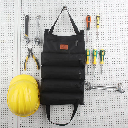 Black tool organizer with tools on a pegboard wall