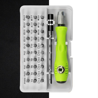 Green screwdriver set with bits on a white background
