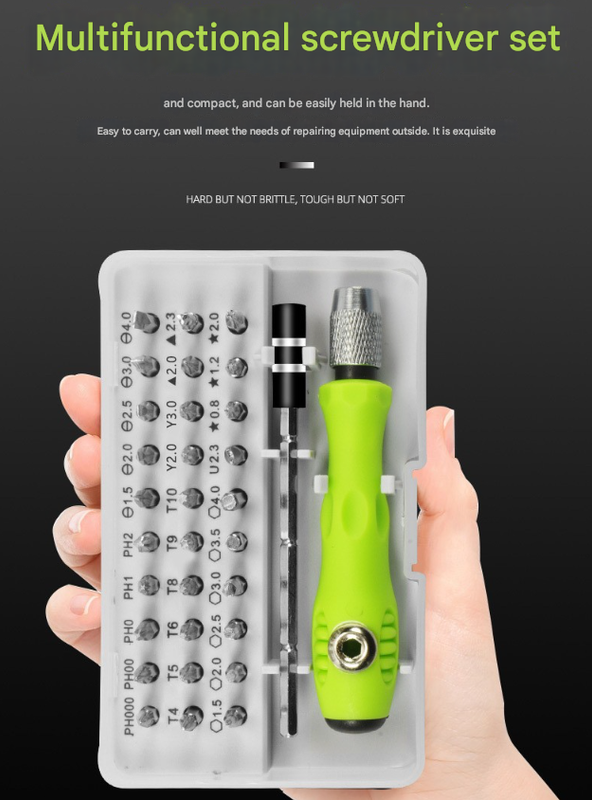 Multifunctional screwdriver set with green handle held by a hand against a black background