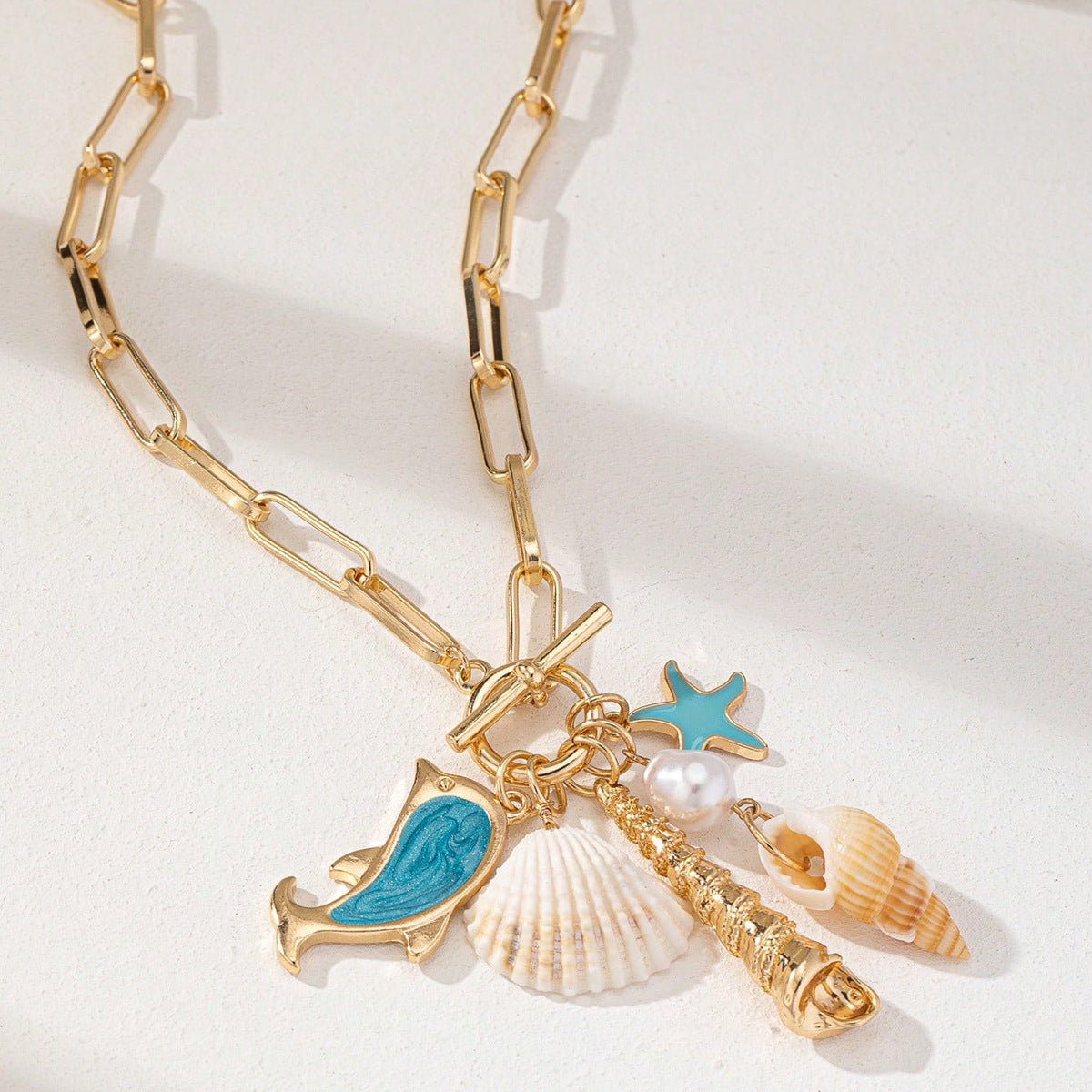 Gold Tone Paperclip Chain Toggle Necklace with Ocean Charms Dolphin Starfish and Seashell Pendant for Summer Beach Holiday - Factory Direct Shop