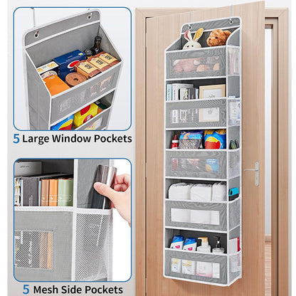 Over-the-door organizer with mesh side and large window pockets on a wooden door.