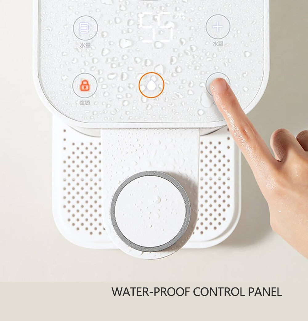 Hand pressing a button on a water-proof control panel with droplets on the surface.