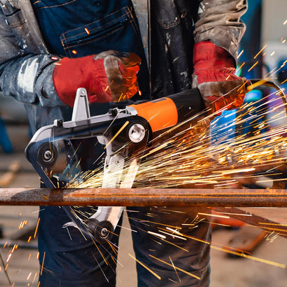 Person using a circular saw with sparks flying, wearing protective gloves.