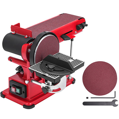 Red belt sander with sandpaper and tools on a white background