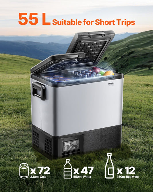 Portable refrigerator with open lid showing contents on grassy field with mountains in the background