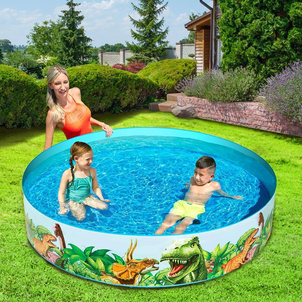 Children playing in a round above-ground swimming pool with dinosaur graphics, accompanied by an adult