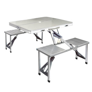 A foldable camping table set with two bench chairs, made of aluminum with a gray finish, displayed in a folded position.