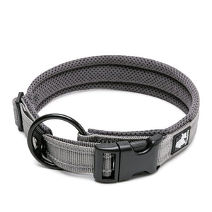 A heavy duty grey dog collar with a safety lock mechanism, stainless steel O ring, and 3M reflectors designed for visibility at night.