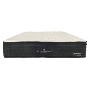 A beige and black king single mattress with latex foam and pocket springs, branded as 'Grandeur'.