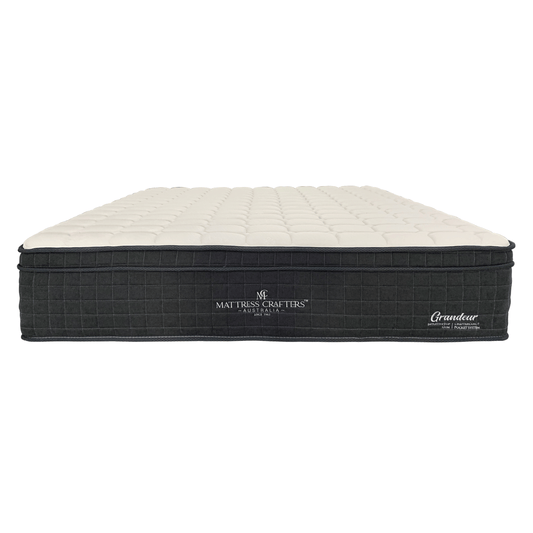 A beige and black king single mattress with latex foam and pocket springs, branded as 'Grandeur'.