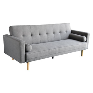 A light grey linen sofa bed with tufted backrest, two pillows, and wooden legs.